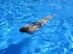 woman swimming underwater