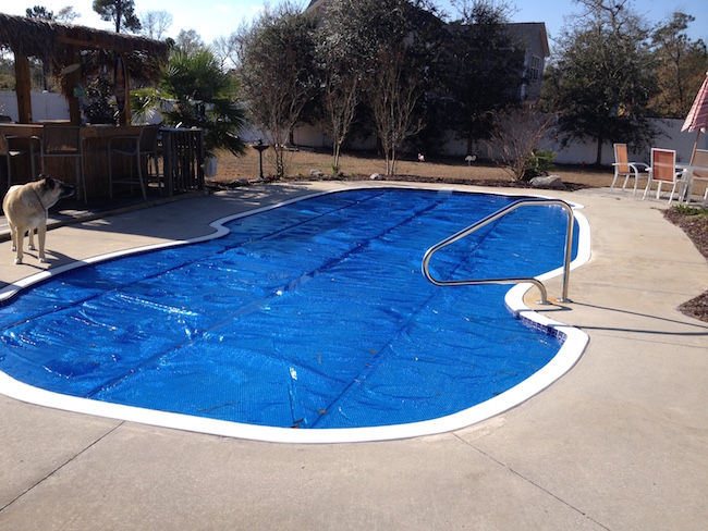 cheap ways to heat your pool solar pool cover solar cover pool reduce heat loss heat inground pool