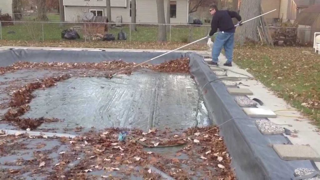 cleaning pool cover to open pool