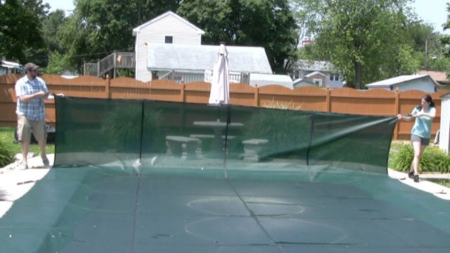 remove pool cover to open a swimming pool