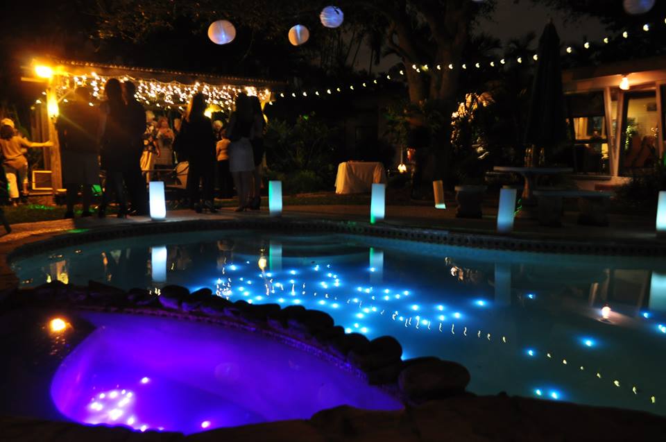 string lights around the pool pool landscaping ideas