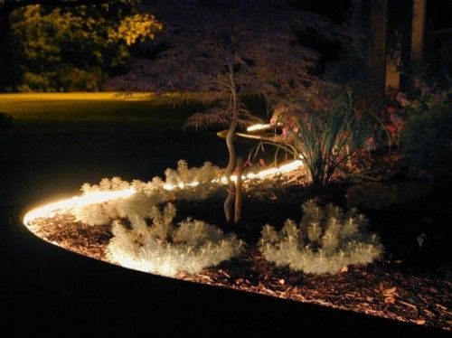 rope lighting around flower beds pool landscaping ideas
