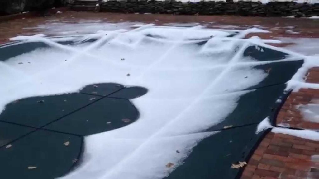 remove snow from your inground pool cover