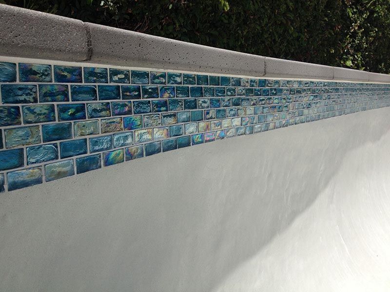 build a swimming pool waterline tile