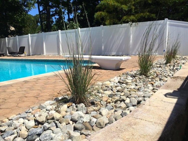 11 Simple Pool Landscaping Ideas That, River Rock Around Pool Deck