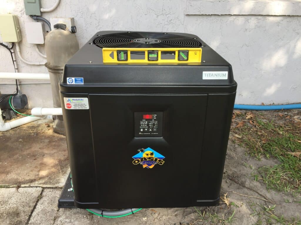 level tool on top of a pool heat pump for maintenance