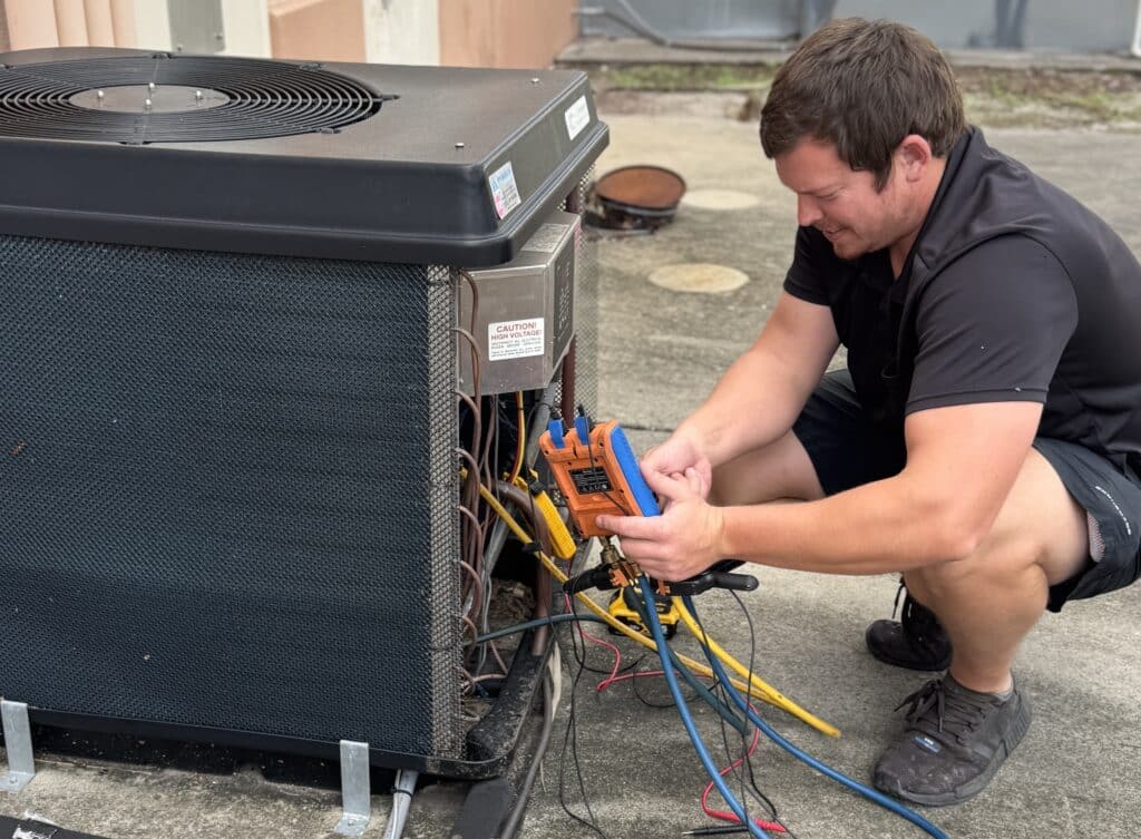 repair technician performing pool heater service and maintenance